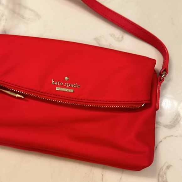 Kate Spade Red cross body purse. Fold over flap style. Zip pocket on front. - Picture 14 of 14